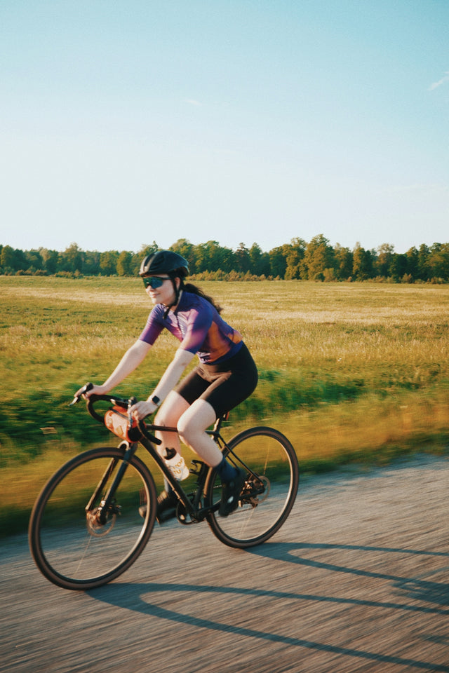 a person riding a bike on a road
