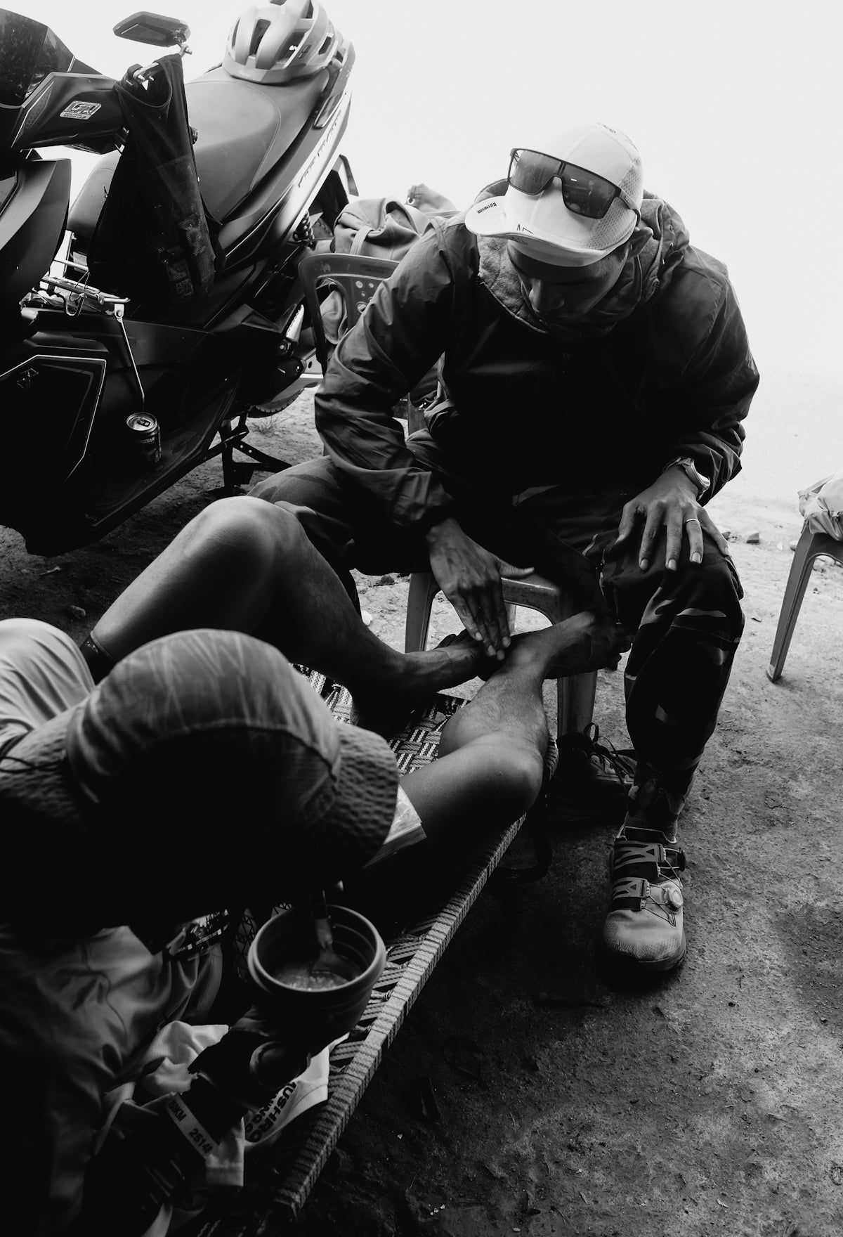 Man giving a foot massage to another man