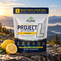 Project L Lemon Burst pouch in a mountain setting with fresh lemon.