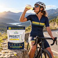 Concept image of a woman cyclist taking a drink, with Project L in the foreground.